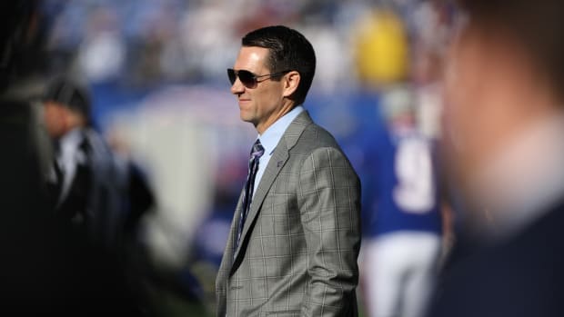 Dec 4, 2022; East Rutherford, New Jersey, USA; New York Giants general manager Joe Schoen (right) looks on before the game against the Washington Commanders at MetLife Stadium.